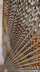 abstract background made of metal. Bijou chains texture closeup with copy space on blurry background