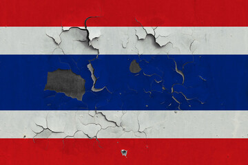 Thailand flag close up old, damaged and dirty on wall peeling off paint to see inside surface. Vintage National Concept.