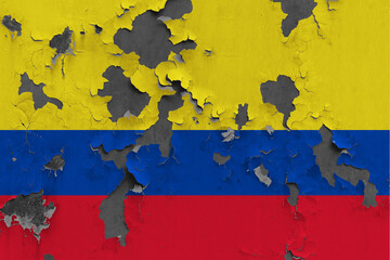 Colombia flag close up painted, damaged and dirty on wall peeling off paint to see concrete surface. Vintage National Concept.