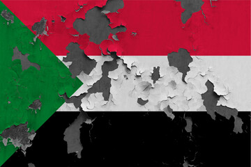 Sudan flag close up painted, damaged and dirty on wall peeling off paint to see concrete surface. Vintage National Concept.
