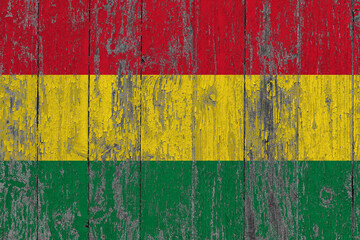 Bolivia flag on grunge scratched wooden surface. National vintage background. Old wooden table scratched flag surface.