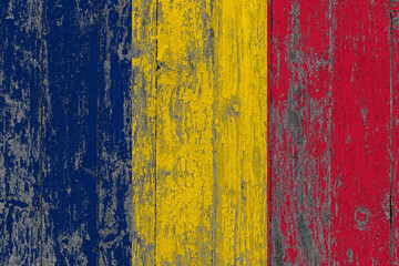 Chad flag on grunge scratched wooden surface. National vintage background. Old wooden table scratched flag surface.