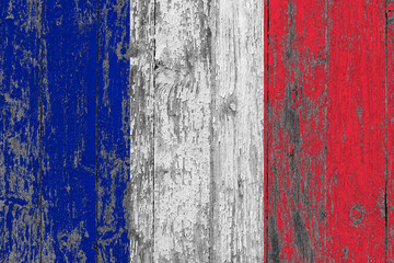 France flag on grunge scratched wooden surface. National vintage background. Old wooden table scratched flag surface.