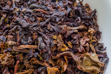 Used and unused dry herbal tea leaves