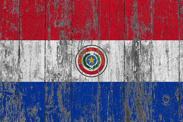 Paraguay flag on grunge scratched wooden surface. National vintage background. Old wooden table scratched flag surface.