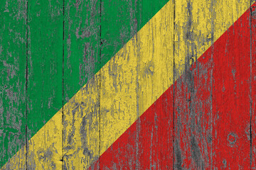 Republic Of The Congo flag on grunge scratched wooden surface. National vintage background. Old wooden table scratched flag surface.