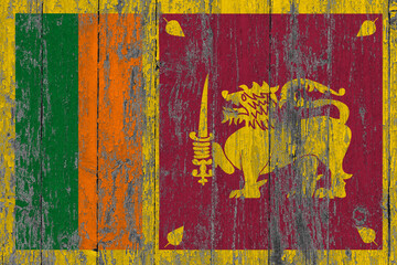 Sri Lanka flag on grunge scratched wooden surface. National vintage background. Old wooden table scratched flag surface.