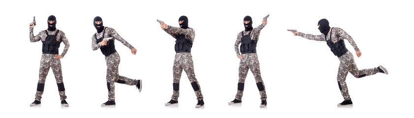 Soldier in camouflage with gun on white