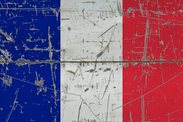 France flag painted on cracked dirty surface. National pattern on vintage style surface. Scratched and weathered concept.
