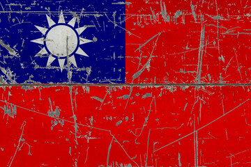 Naklejka premium Taiwan flag painted on cracked dirty surface. National pattern on vintage style surface. Scratched and weathered concept.