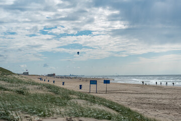 Fototapeta na wymiar Paragliding at Noordwijk beach in the netherlands