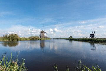 windmills in the netherlands along a canal
