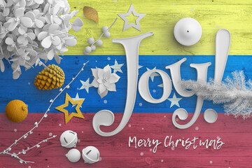 Venezuela flag on wooden table with joy text. Christmas and new year background, celebration...