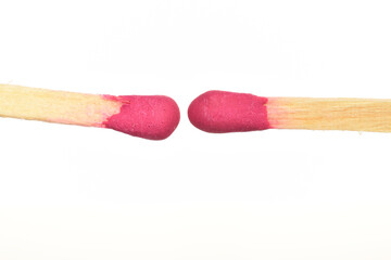 Matches made of wood, close-up, on a white background.
