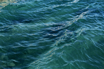 Naklejka premium Blue sea close-up. Background. Texture. Substrate.