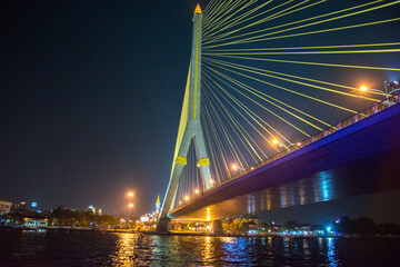 Fototapeta na wymiar Rama VIII Bridge at night beautiful bridge across the Chao Phraya river at dusk in Bangkok, Thailand