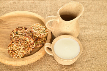 A few delicious walnut cookies, close-up, on jute fabric.