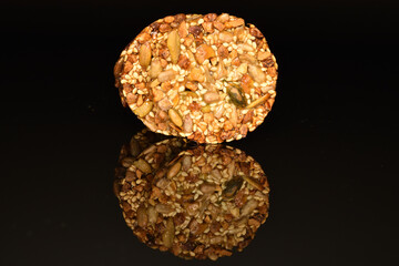 Several fresh fragrant tasty nutty cookies on a black background.