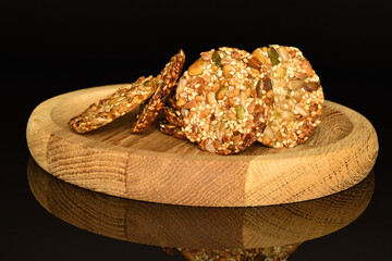 Several fresh fragrant tasty nutty cookies on a black background.