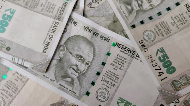 Closeup of brand new 500 Rs green colorful Indian currency bank notes issued and in circulation after demonetisation