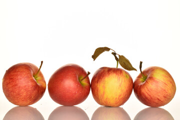 Fototapeta na wymiar Ripe red apples, close-up, on a white background.