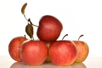 Ripe red apples, close-up, on a white background.