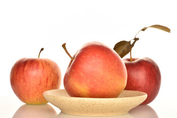 Ripe red apples, close-up, on a white background.