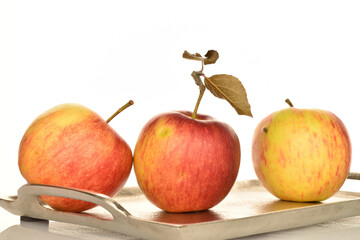 Ripe red apples, close-up, on a white background.