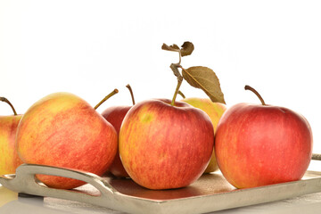 Ripe red apples, close-up, on a white background.