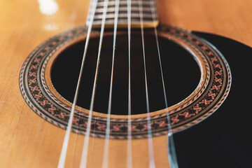Obraz premium Closeup detail of classical guitar with nylon strings.