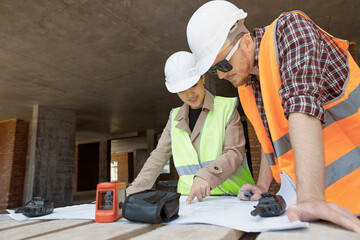 The engineer and worker control and check and coordinate the construction process