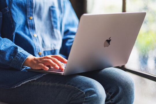 Jun 27th 2020 : A woman using and working on Apple MacBook Pro laptop computer , Chiang mai Thailand