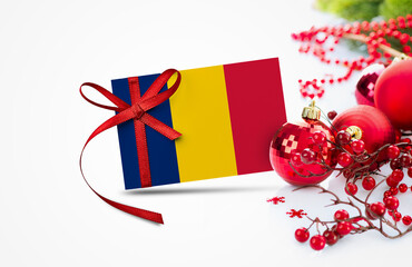 Chad flag on new year invitation card with red christmas ornaments concept. National happy new year...