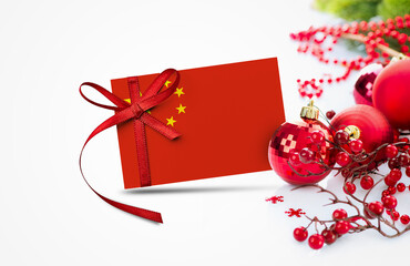 China flag on new year invitation card with red christmas ornaments concept. National happy new year composition.