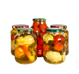 Canned vegetables in glass jars isolated on white background