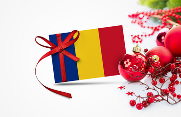 Romania flag on new year invitation card with red christmas ornaments concept. National happy new year composition.