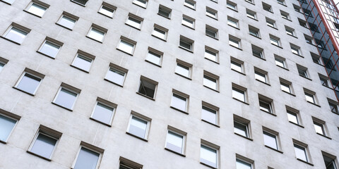 facade of residential building wall with glass windows front exterior view outdoor