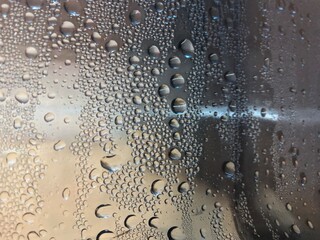 Water drops on a plastic bottle surface. Selective focus this image