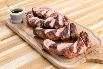 smoked sausage on wooden table