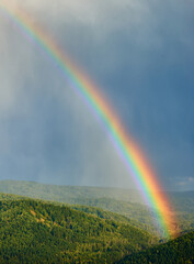 Fototapeta premium Rainbow over the Altai Mountains