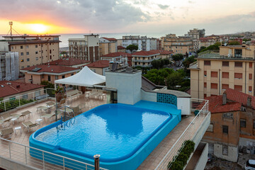 Fototapeta na wymiar Hotel rooftop swimming pool in Lido di Camaiore. Italy
