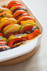 Ratatouille - national french food. Baked vegetables with tomato sauce in a ceramic bowl....