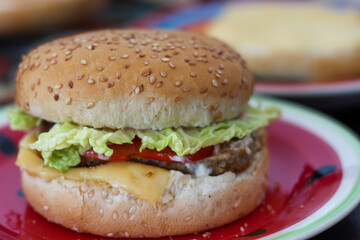 Fresh juicy burger. Sesame bun, cutlet, cheese, lettuce, sauce. 