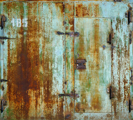 Metal garage doors painted by people as an abstract painting