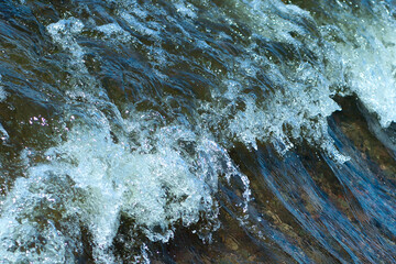 White sea foam formed by the wave. Sea lamb