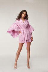 Woman beautiful face natural make up brunette hair tanned skin body wear fashion summer collection...