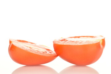 Red plum tomato, macro isolated on a white background.