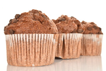 Chocolate muffins, close-up, isolated on a white background.