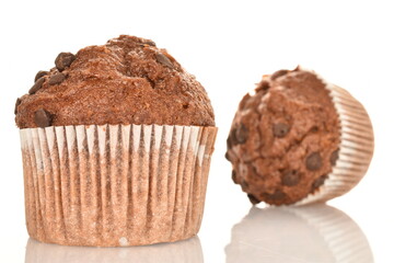 Chocolate muffins, close-up, isolated on a white background.