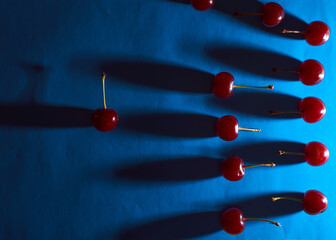 cherry on blue background with shadows effect